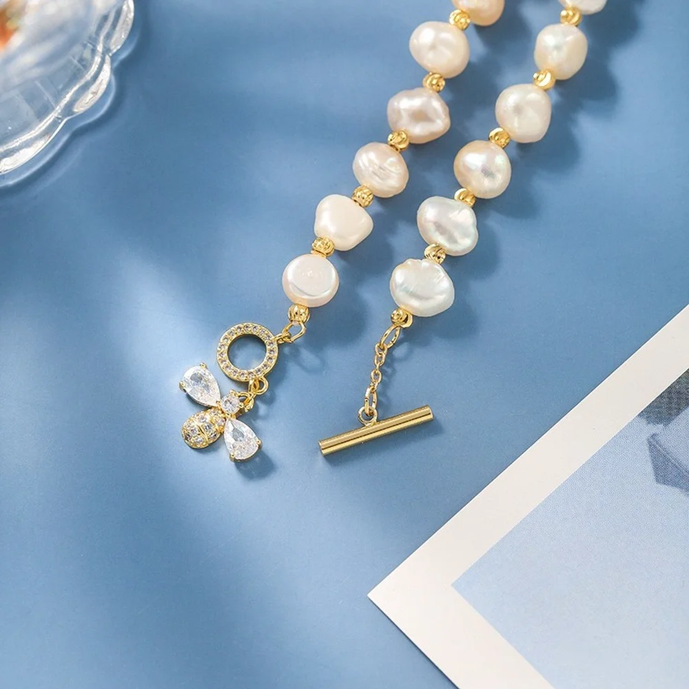 Natural pearl micro-inlaid craft zircon bee bracelet design sense bracelet ins style pearl chain bracelet female
Natural pearl micro-inlaid craft zircon bee bracelet design sense bracelet ins style pearl chain bracelet female