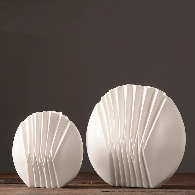 Modern and Simple White Ceramic Creative Personality Fashion Vase Round Bottle Living Room Tea Cabinet Dry Vase Decoration
Modern and Simple White Ceramic Creative Personality Fashion Vase Round Bottle Living Room Tea Cabinet Dry Vase Decoration