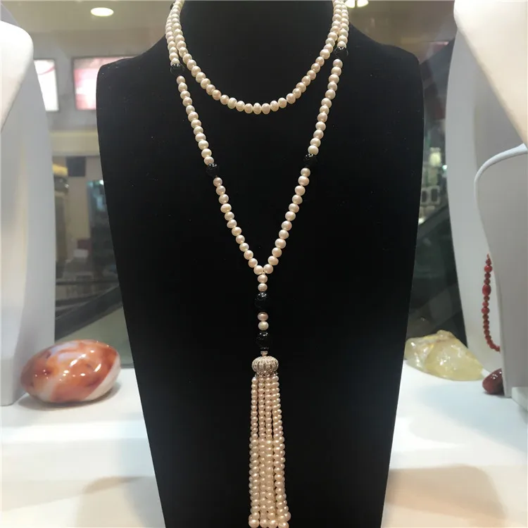 Hand knotted long natural 5-6mm white freshwater pearl inlaid with black stone tassel necklace sweater chain fashion jewelry
Hand knotted long natural 5-6mm white freshwater pearl inlaid with black stone tassel necklace sweater chain fashion jewelry