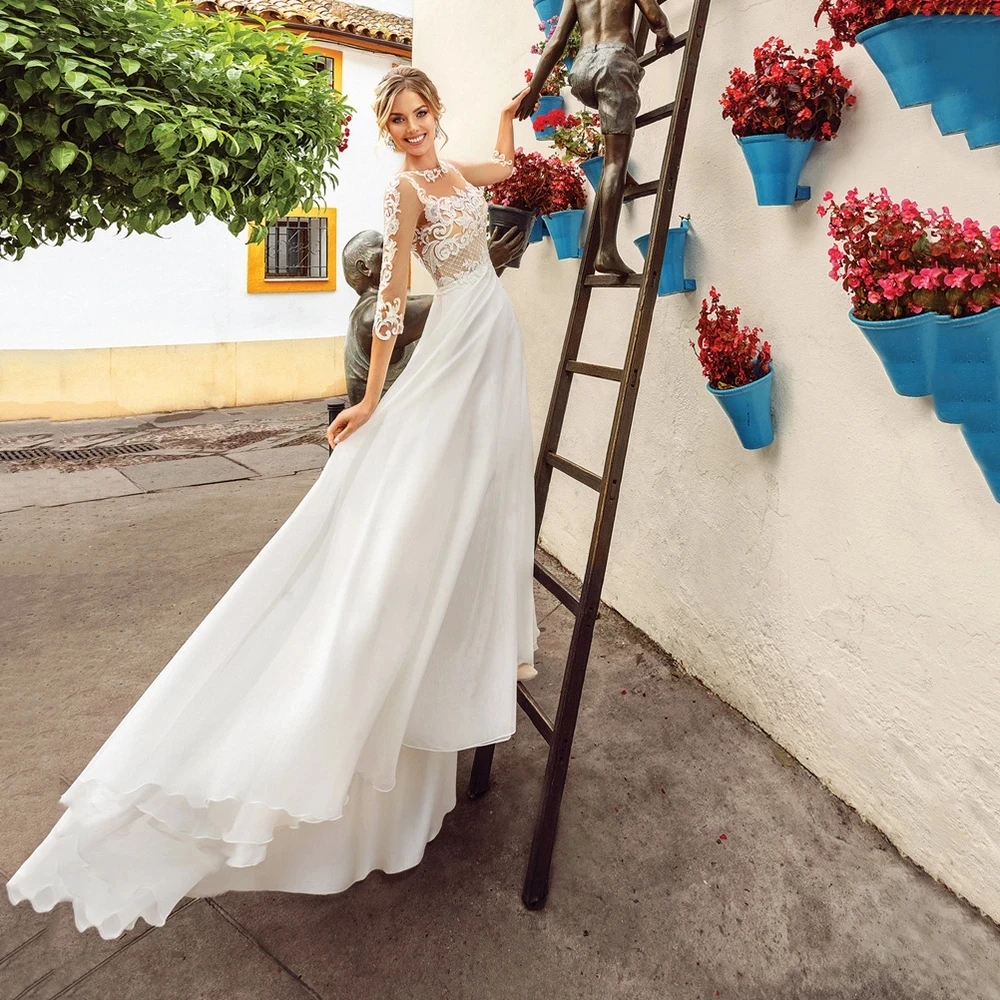 Sexy Wedding Dresses Chiffon Appliques Lace Pleat O-Neck Three Quarter Covered Button A-Line Bridal Gowns Novia Do 2021
Sexy Wedding Dresses Chiffon Appliques Lace Pleat O-Neck Three Quarter Covered Button A-Line Bridal Gowns Novia Do 2021