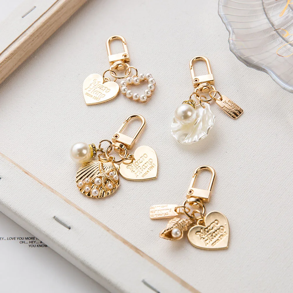 Cute Love Letter Heart Keychain Toy Baby Girl Korean Shell Conch Pearl Key Chain Bag Charms Gold Key Ring Key Accessories
Cute Love Letter Heart Keychain Toy Baby Girl Korean Shell Conch Pearl Key Chain Bag Charms Gold Key Ring Key Accessories