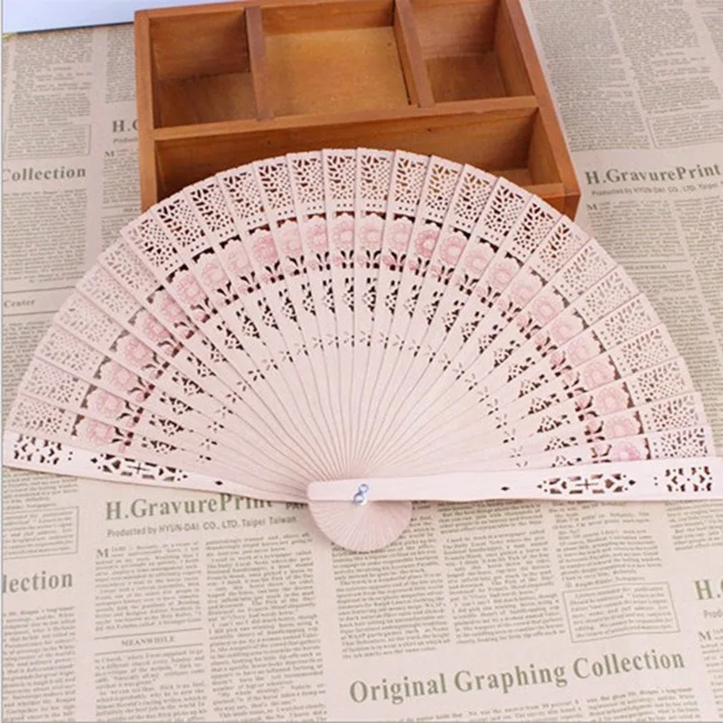 Wooden folding fan small gift small mixed batch hollow wooden carving fan with printing and independent packaging fold fans
Wooden folding fan small gift small mixed batch hollow wooden carving fan with printing and independent packaging fold fans