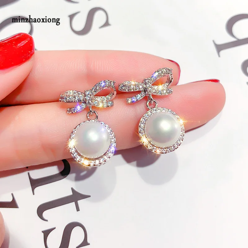 2020 New Fashion ZC Zombie Bow Dangle Earrings Senior Sense Earrings For Women Temperament Pearl Earrings Party Wedding Gift
2020 New Fashion ZC Zombie Bow Dangle Earrings Senior Sense Earrings For Women Temperament Pearl Earrings Party Wedding Gift