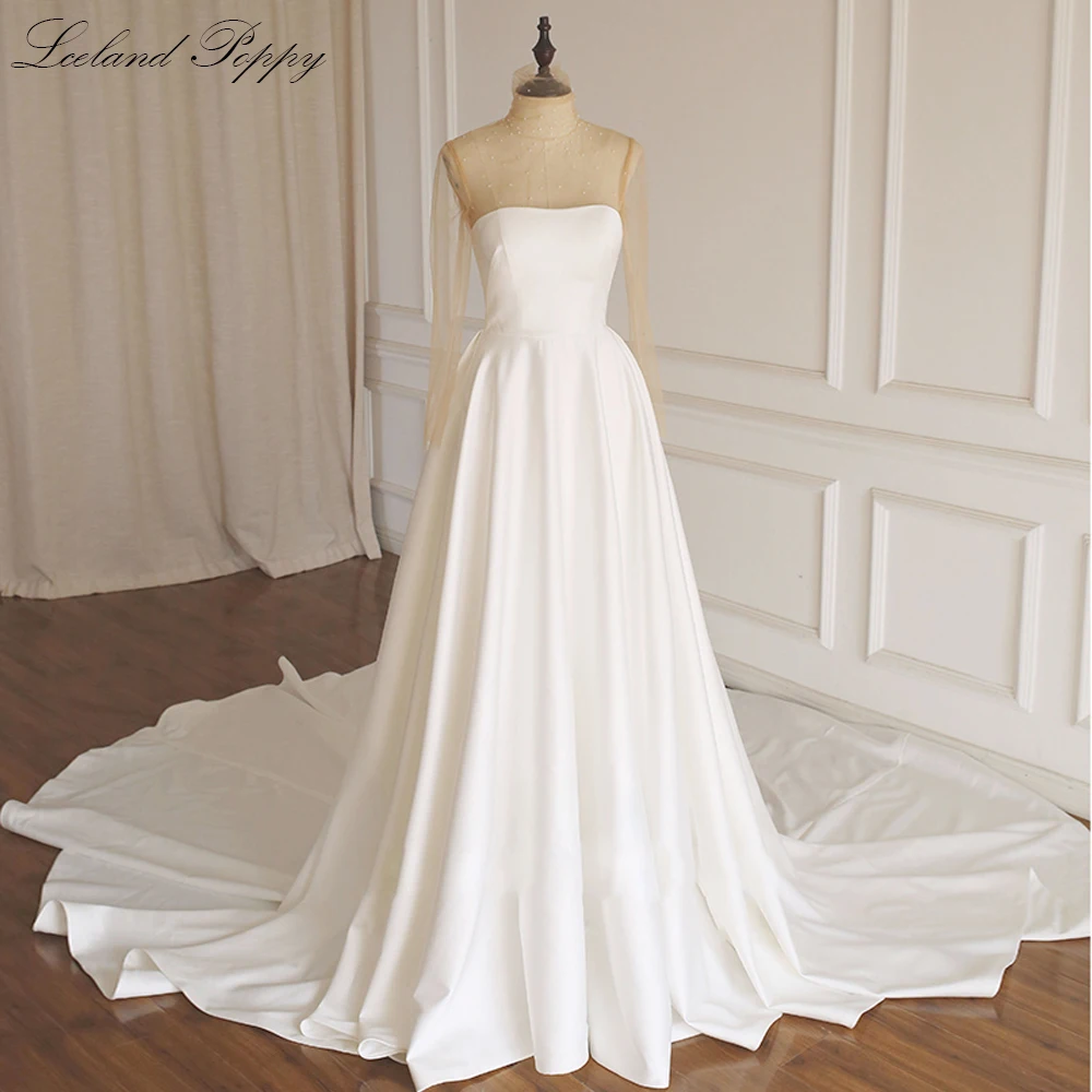 Lceland Poppy A-line Illusion Full Sleeves Satin Wedding Dresses Pearls Beaded Vestido de Novia Chapel Train Bridal Gowns
Lceland Poppy A-line Illusion Full Sleeves Satin Wedding Dresses Pearls Beaded Vestido de Novia Chapel Train Bridal Gowns
