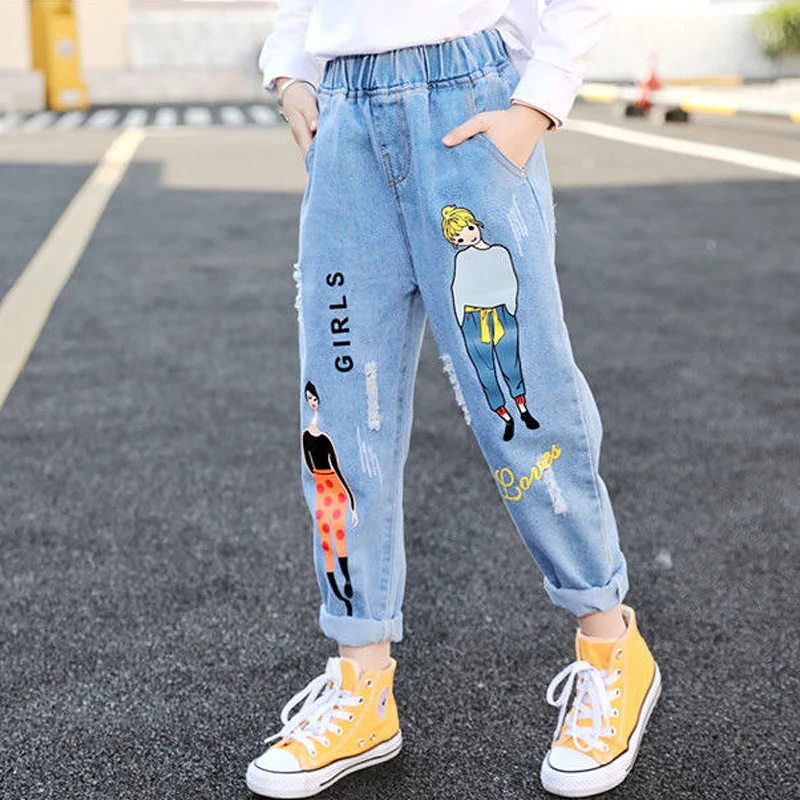 Модные джинсы с мультяшным рисунком для девочек-подростков, детские джинсовые брюки с эластичным поясом, детские брюки для девочек 
Модные джинсы с мультяшным рисунком для девочек-подростков, детские джинсовые брюки с эластичным поясом, детские брюки для девочек