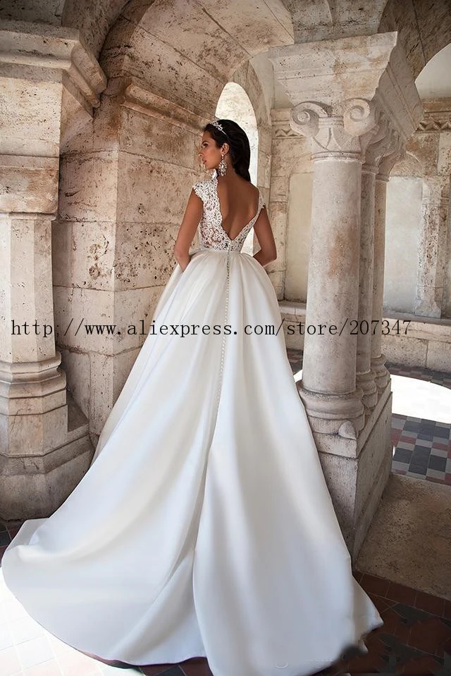 2019 Wedding Dresses With Pockets Cheap Boat Neck Capped Sleeves Lace Appliques Backless Satin Court Train Bridal Gowns
2019 Wedding Dresses With Pockets Cheap Boat Neck Capped Sleeves Lace Appliques Backless Satin Court Train Bridal Gowns