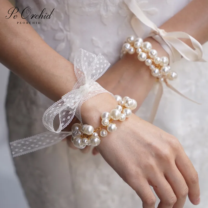 PEORCHID Vintage Pearl Wedding Bracelets For Bridesmaids Wrist flower Bracelet Corsage Bridal Prom Party Accessoires De Mariage 
PEORCHID Vintage Pearl Wedding Bracelets For Bridesmaids Wrist flower Bracelet Corsage Bridal Prom Party Accessoires De Mariage