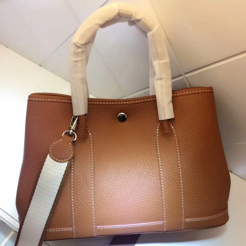 2021 Spring New Leather Ladies Bag Lychee Pattern Top Layer Cowhide Handbag Fashion Shoulder Bag Designer Handbags High Quality
2021 Spring New Leather Ladies Bag Lychee Pattern Top Layer Cowhide Handbag Fashion Shoulder Bag Designer Handbags High Quality