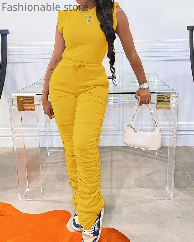 Топ без рукавов с застежкой-молнией сзади и брюки со шнурком с высокой талией 
Топ без рукавов с застежкой-молнией сзади и брюки со шнурком с высокой талией