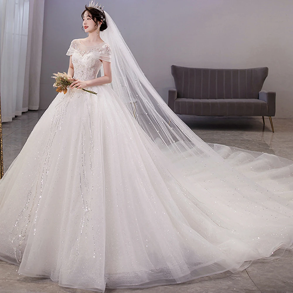 Dioflyusa Luxury Lace Princess Wedding Dress For Women 2021 Champagne Boat Neck Leak Back Bride Dresses Sexy Bridal Ball Gowns
Dioflyusa Luxury Lace Princess Wedding Dress For Women 2021 Champagne Boat Neck Leak Back Bride Dresses Sexy Bridal Ball Gowns