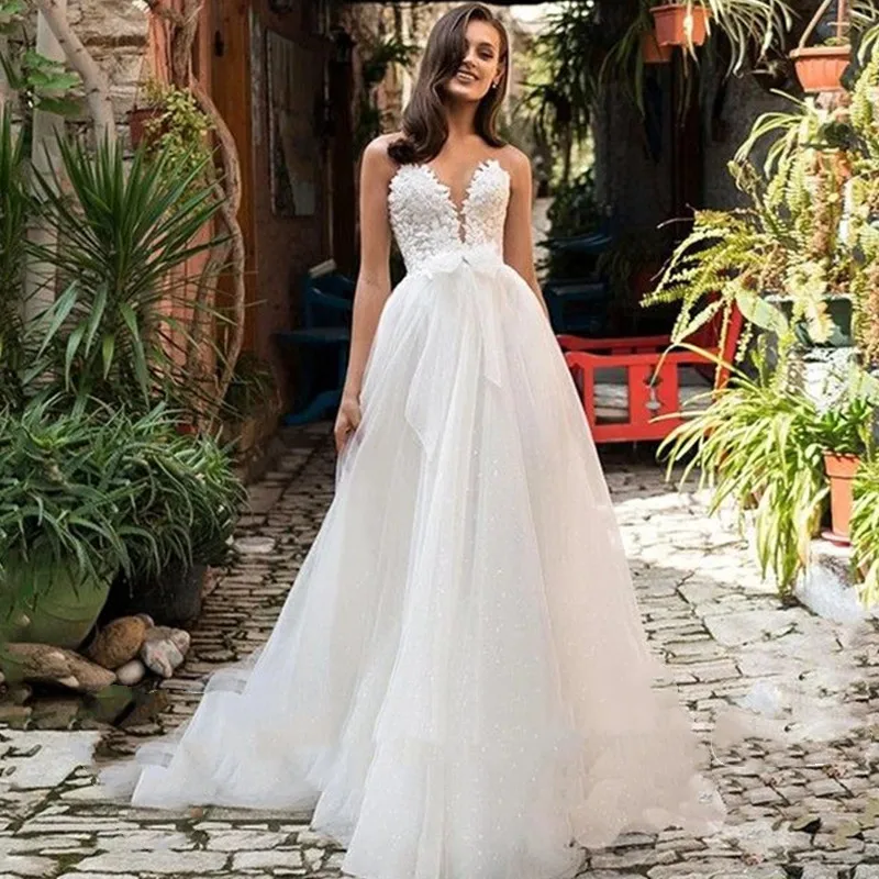 Luxury Elegant A-Line Wedding Dresses V-Neck Lace Appliques Backless Chapel Train Sleeveless Bow Custom Made Bride Gown Hot Sale
Luxury Elegant A-Line Wedding Dresses V-Neck Lace Appliques Backless Chapel Train Sleeveless Bow Custom Made Bride Gown Hot Sale