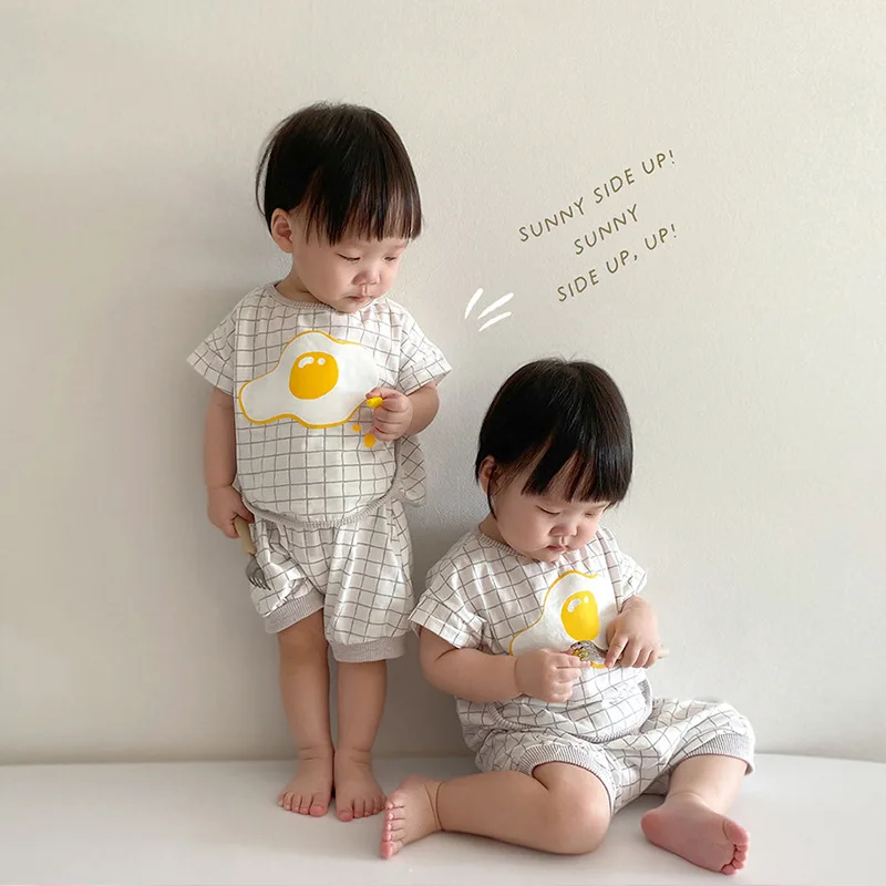 2021 Summer New Toddler Baby Clothes Set Boy Plaid Cartoon Poached Egg Pattern Short Sleeve Tops + Kid Girl Soft Shorts 2pcs
2021 Summer New Toddler Baby Clothes Set Boy Plaid Cartoon Poached Egg Pattern Short Sleeve Tops + Kid Girl Soft Shorts 2pcs