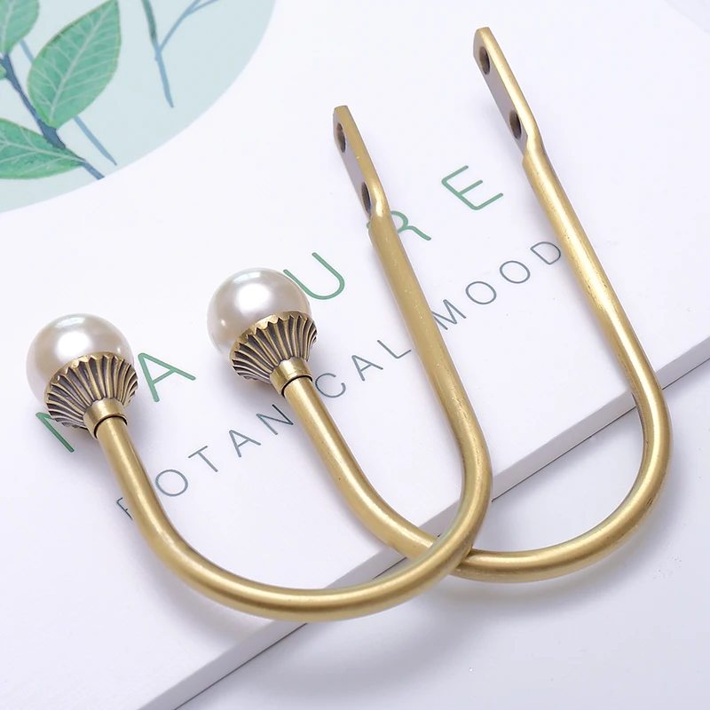 Pearl u-shaped curtain wall hook hook wall hook zinc alloy modern minimalist fashion Nordic style accessories in pairs
Pearl u-shaped curtain wall hook hook wall hook zinc alloy modern minimalist fashion Nordic style accessories in pairs