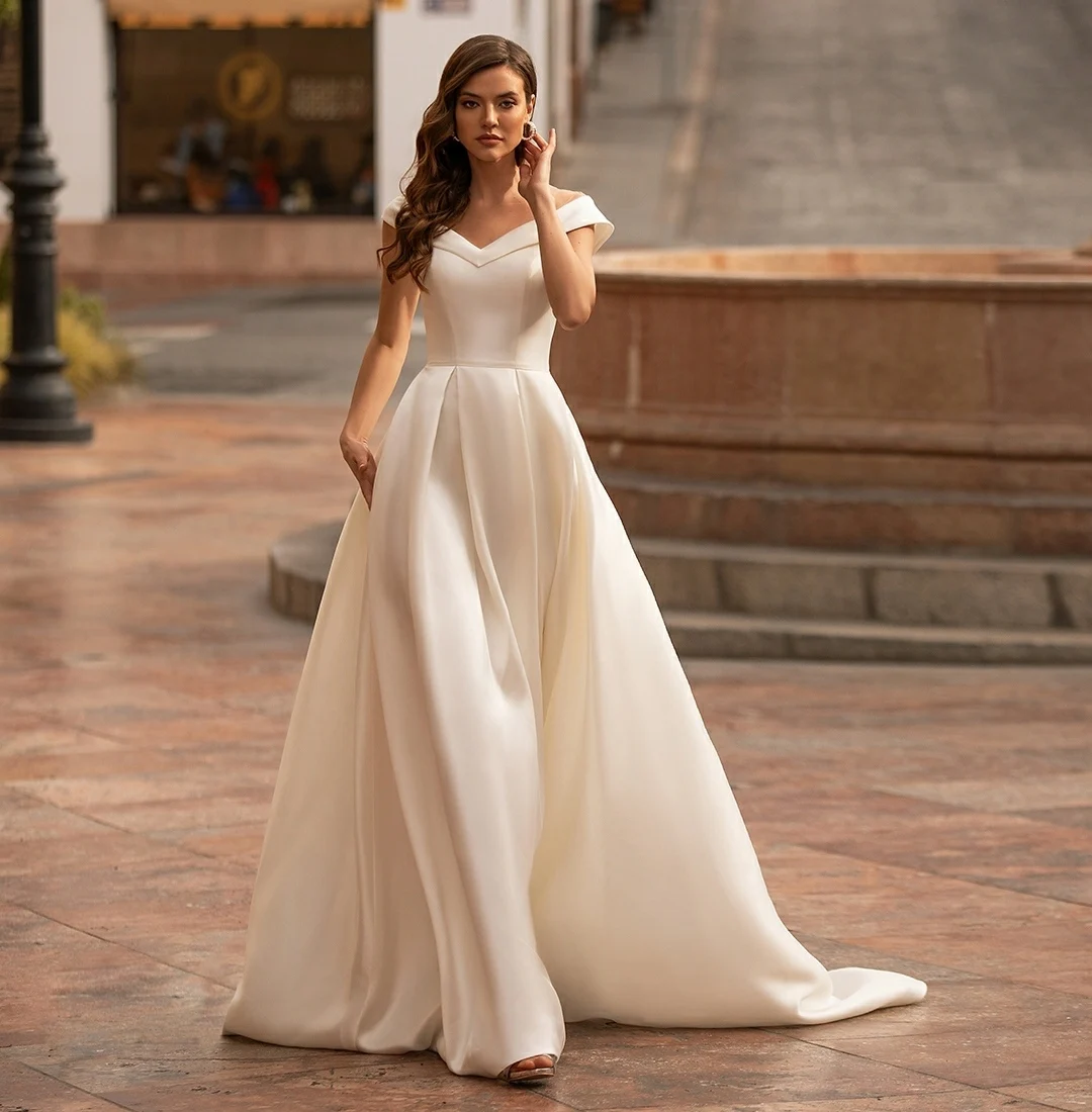 Vintage Long V-Neck Satin Wedding Dresses with Pockets A-Line Illusion Back Ivory Robes De Mariée Bridal Gown For Women
Vintage Long V-Neck Satin Wedding Dresses with Pockets A-Line Illusion Back Ivory Robes De Mariée Bridal Gown For Women
