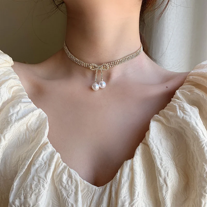 Origin Summer Temperament Bowknot Chokers Necklace for Women Bling Bling Rhinestone Simulation Pearl Dangle Necklace Jewellery
Origin Summer Temperament Bowknot Chokers Necklace for Women Bling Bling Rhinestone Simulation Pearl Dangle Necklace Jewellery