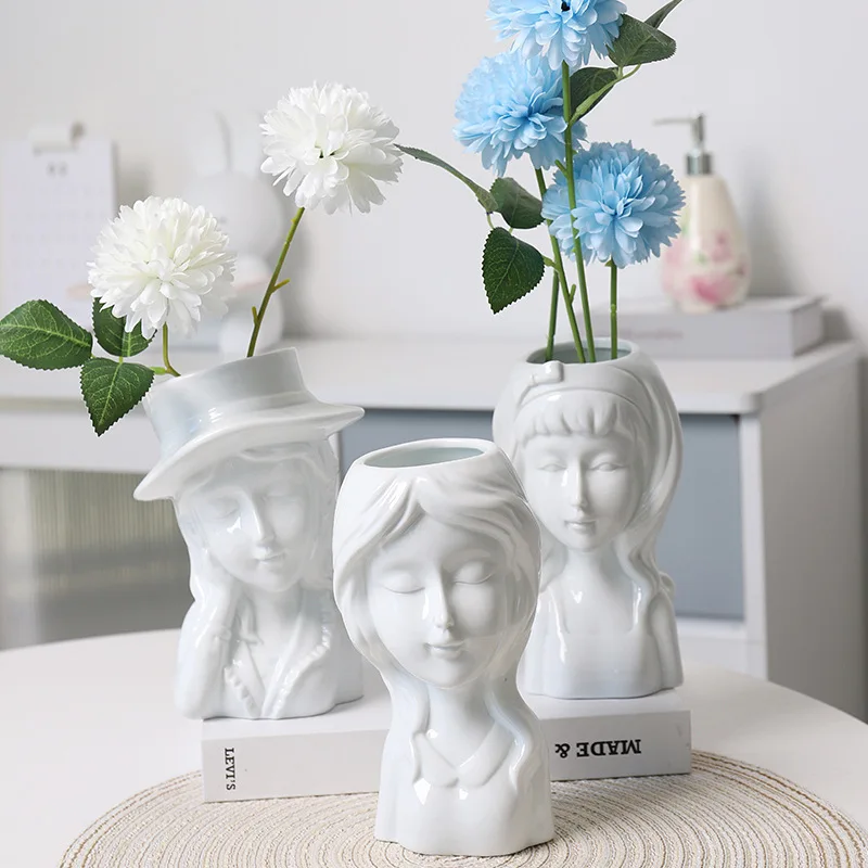 Nordic style simple beautiful girl face ceramic vase living room dry flower arrangement ornaments artist home decoration
Nordic style simple beautiful girl face ceramic vase living room dry flower arrangement ornaments artist home decoration