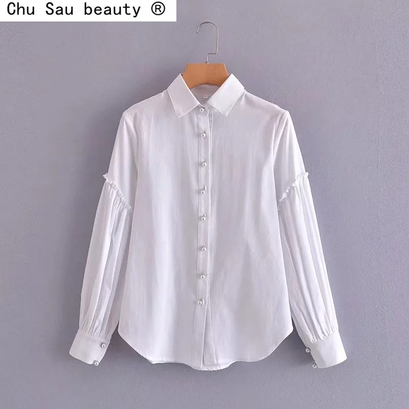 2022 Spring Autumn New Vintage Loose White Pearl Buckle Ruffle Stitching Long-Sleeved Shirt Blouse Top Women
2022 Spring Autumn New Vintage Loose White Pearl Buckle Ruffle Stitching Long-Sleeved Shirt Blouse Top Women