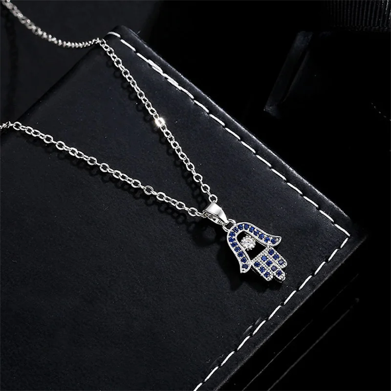 OBYB Shiny Blue Zircon Hamsa Hand of Fatima Lady Crystal Pendant Jewelry Choker Vintage Necklace For Women Fashion Jewelry Gifts
OBYB Shiny Blue Zircon Hamsa Hand of Fatima Lady Crystal Pendant Jewelry Choker Vintage Necklace For Women Fashion Jewelry Gifts