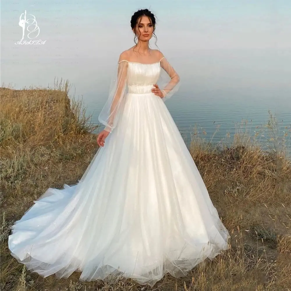 Princess Wedding Dresses Sheer Neck Long Lantern Sleeve Off the Shoulder Tulle Court Train Beach Bridal Gowns Vestidos De Noiva
Princess Wedding Dresses Sheer Neck Long Lantern Sleeve Off the Shoulder Tulle Court Train Beach Bridal Gowns Vestidos De Noiva