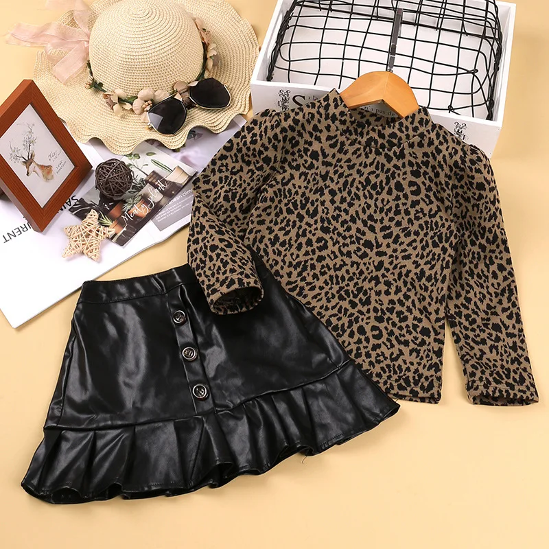 New European and American girl suit leopard print long-sleeved bottoming shirt + leather short skirt two-piece suit
New European and American girl suit leopard print long-sleeved bottoming shirt + leather short skirt two-piece suit