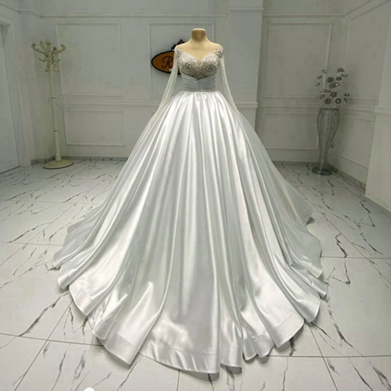 Off The Shoulder Crystals Pearls Wedding Dress V Neck Illusion Button Pleats Satin A-line Wedding Gowns For Bridal Guest Party
Off The Shoulder Crystals Pearls Wedding Dress V Neck Illusion Button Pleats Satin A-line Wedding Gowns For Bridal Guest Party