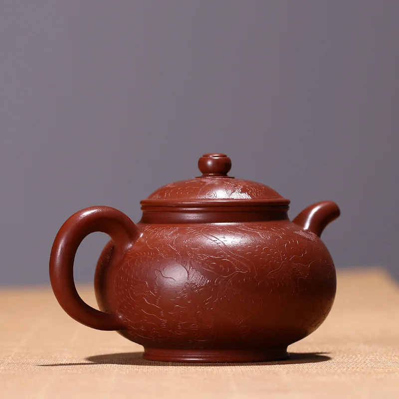 Antique purple clay pot carved dragon pattern Dahongpao teapot handmade teaware gift 
Antique purple clay pot carved dragon pattern Dahongpao teapot handmade teaware gift