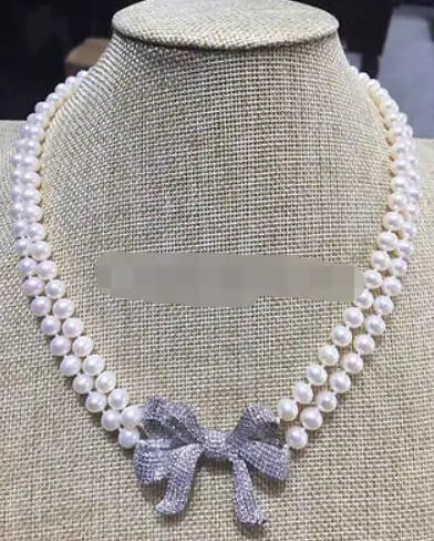 P7526 - 2row 19-20" 8-9mm white round freshwater pearl necklace - zircon bowknot
P7526 - 2row 19-20" 8-9mm white round freshwater pearl necklace - zircon bowknot