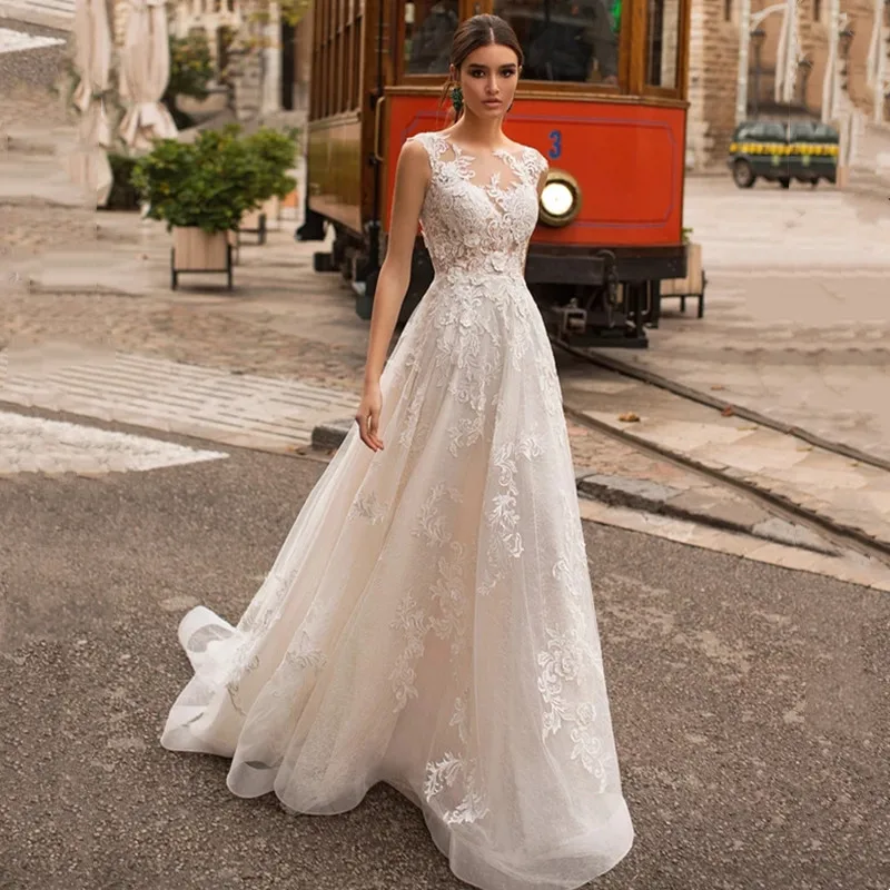 Modern O-Neck A-Line Wedding Dress With Lace Appliques Sleeveless Fashion Button Bridal Gown Tulle Sweep Train Vestidos De Novia
Modern O-Neck A-Line Wedding Dress With Lace Appliques Sleeveless Fashion Button Bridal Gown Tulle Sweep Train Vestidos De Novia