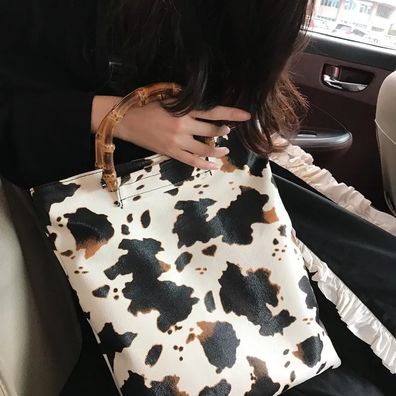 2023 Vintage Cow Pattern Women Handbags Designer Bamboo Handle Hand Bags Casual Large Capacity Tote Female Purse lady Bucket Bag 
2023 Vintage Cow Pattern Women Handbags Designer Bamboo Handle Hand Bags Casual Large Capacity Tote Female Purse lady Bucket Bag