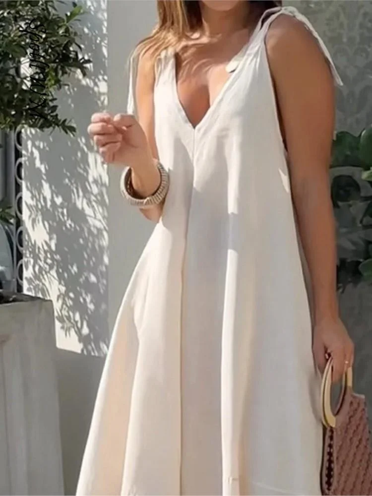 Женское свободное платье на бретельках, повседневное однотонное платье-трапеция без рукавов с V-образным вырезом и открытой спиной, лето 2023 
Женское свободное платье на бретельках, повседневное однотонное платье-трапеция без рукавов с V-образным вырезом и открытой спиной, лето 2023
