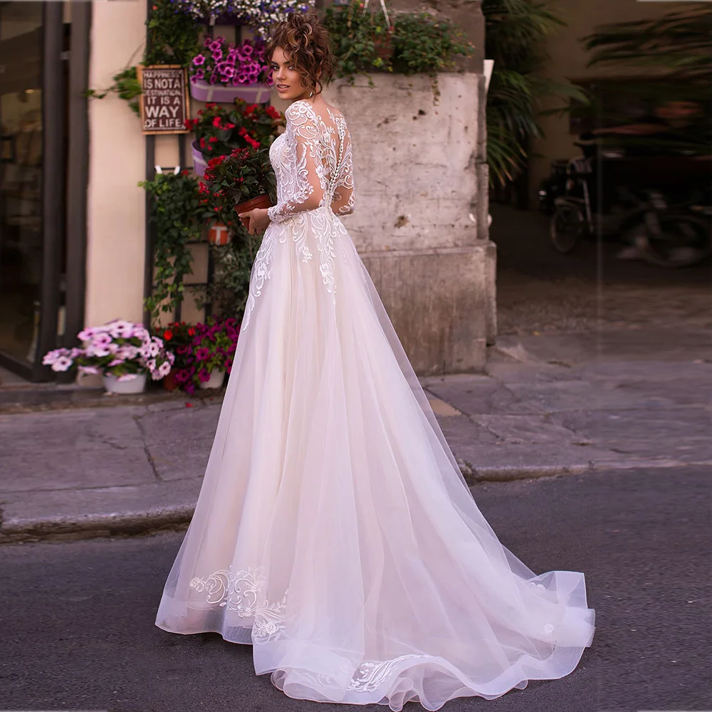Pastrol Cut Out Wedding Dresses V-Neck Long Sleeves Tulle Dress A-Line Lace Appliques Illusion Back Button Bridal Gowns Vestidos 
Pastrol Cut Out Wedding Dresses V-Neck Long Sleeves Tulle Dress A-Line Lace Appliques Illusion Back Button Bridal Gowns Vestidos