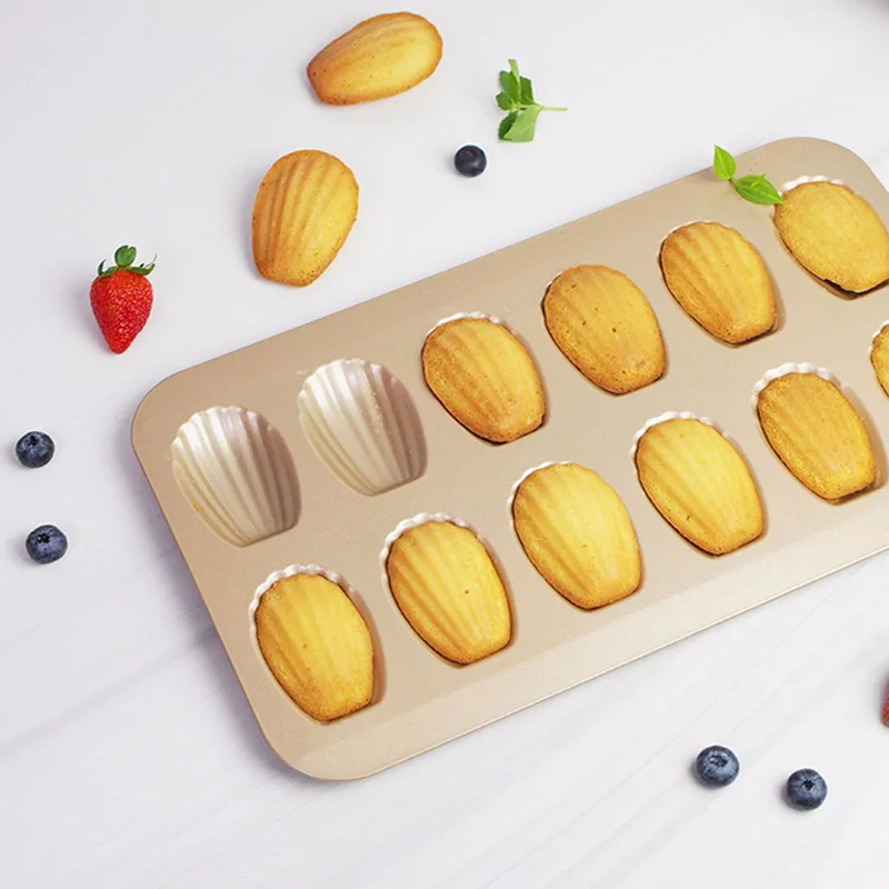12 Grids Shell Baking Tray Cartoon Steel Rectangle Macaron Cake Bread Comal Kitchen Oven Cake Tools
12 Grids Shell Baking Tray Cartoon Steel Rectangle Macaron Cake Bread Comal Kitchen Oven Cake Tools