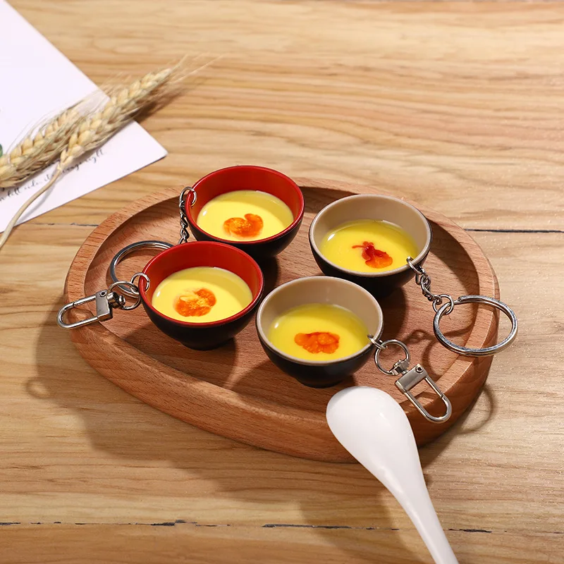 Mini 3D Food Keychain Creative Fashion Simulation Steamed Egg DIY Model Photography Props Car Bag Pendant Ornaments Gift Trinket
Mini 3D Food Keychain Creative Fashion Simulation Steamed Egg DIY Model Photography Props Car Bag Pendant Ornaments Gift Trinket