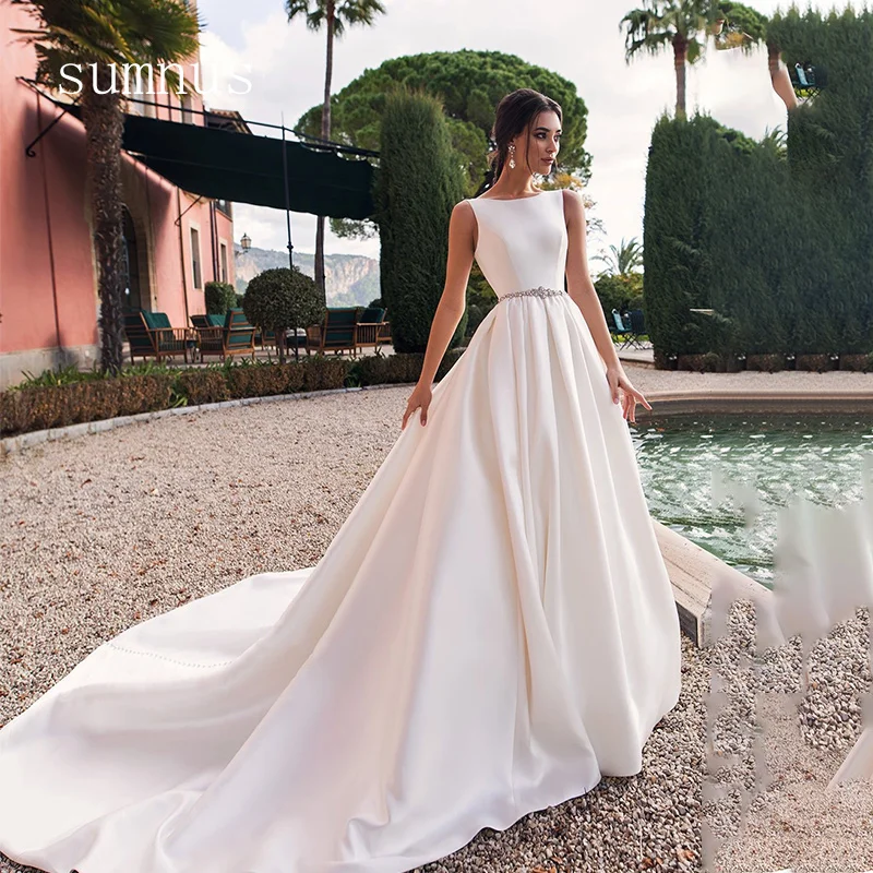 Solid Satin Ball Gowns O-Neck Backless Sleeveless For Beach Vacation Party Elegant Wedding Dress With Sashes Robe de Mariee
Solid Satin Ball Gowns O-Neck Backless Sleeveless For Beach Vacation Party Elegant Wedding Dress With Sashes Robe de Mariee