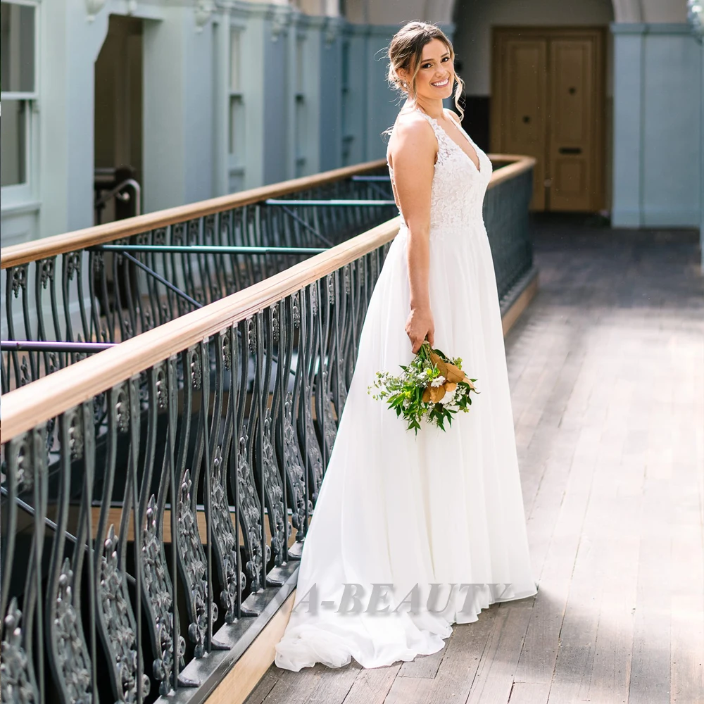 Anna Fairytale Halter Wedding Dresses Backless Chiffon A Line Pleats Sleeveless V Neck Court Train Robe De Soirée De Mariage
Anna Fairytale Halter Wedding Dresses Backless Chiffon A Line Pleats Sleeveless V Neck Court Train Robe De Soirée De Mariage
