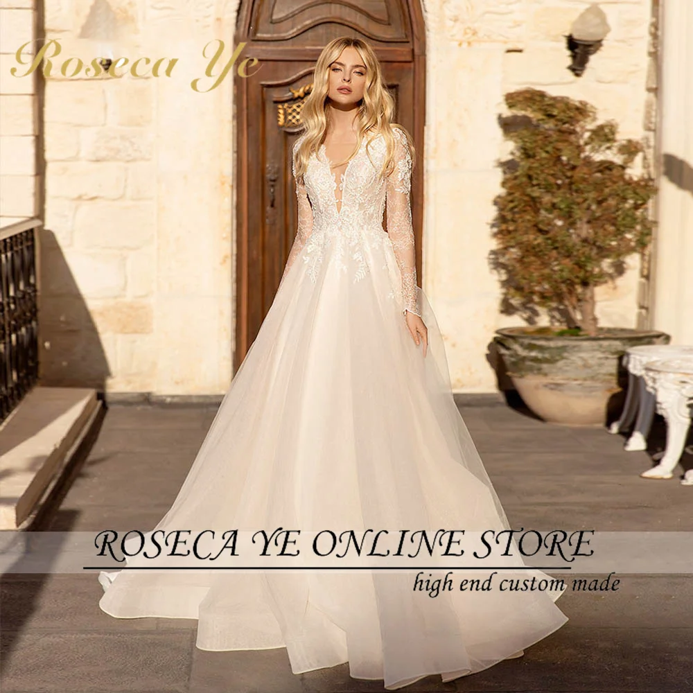 

Roseca Ye A-Line Wedding Dress 2022 Charming Beading Lace Appliques Bride V-Neck Long Sleeve Button Court Train Bridal Gowns