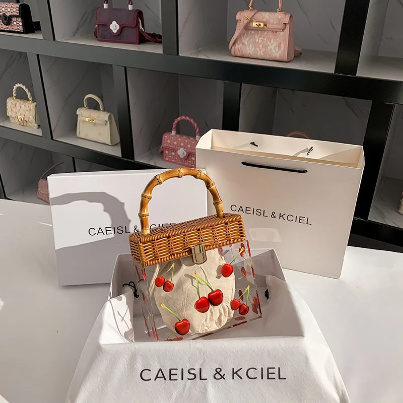 Niche Cherry Hand Bags For Women Transparent Acrylic Beach Bag New Rattan Woven Advanced Sense Of Resort Wind Camera Bag
Niche Cherry Hand Bags For Women Transparent Acrylic Beach Bag New Rattan Woven Advanced Sense Of Resort Wind Camera Bag