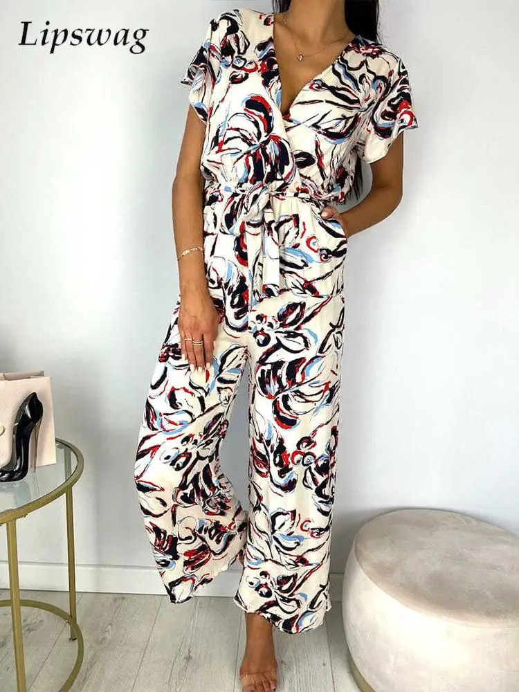 Elegant Ruffles Short Sleeve Long Pant Romper Summer V Neck Lace Up Pocket Playsuit Ladies Casual Print Waist Wide Leg Jumpsuits
Elegant Ruffles Short Sleeve Long Pant Romper Summer V Neck Lace Up Pocket Playsuit Ladies Casual Print Waist Wide Leg Jumpsuits