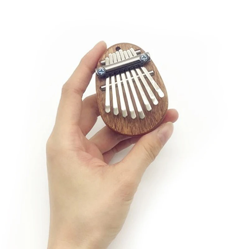 Mini Kalimba 8 Keys Thumb Piano Great Sound Finger Keyboard Musical Instrument 
Mini Kalimba 8 Keys Thumb Piano Great Sound Finger Keyboard Musical Instrument