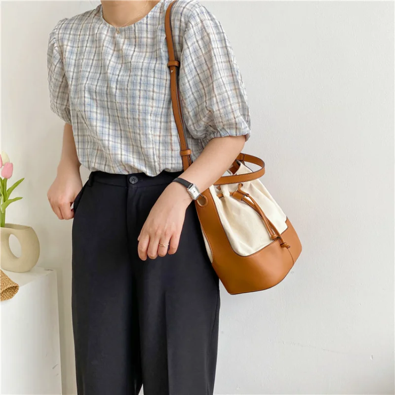 

New Drawstring Canvas Shoulder Bag Korean Fashion Trend Diagonal Straddle Bag Spliced PU Leather Bucket Bag Free Shipping