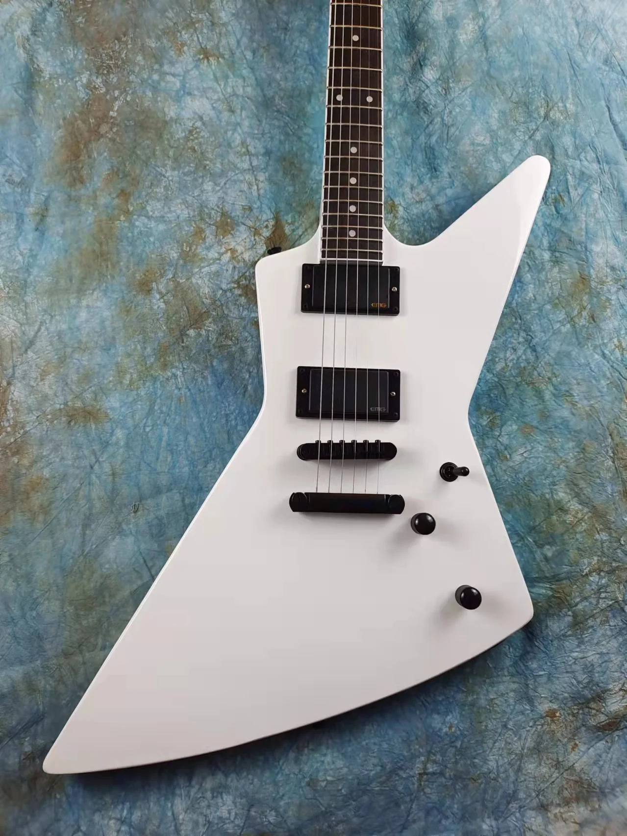 

Shaped Electric guitar, white, EMG active pickup, mahogany, rosewood fingerboard, white pearl inlay, available, including mail