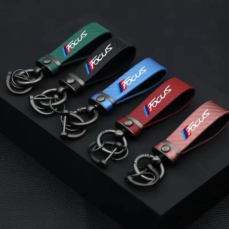 

New car key chain custom logo Ford Focus car carbon fiber pattern 360-degree rotating horseshoe ring key chain gift.