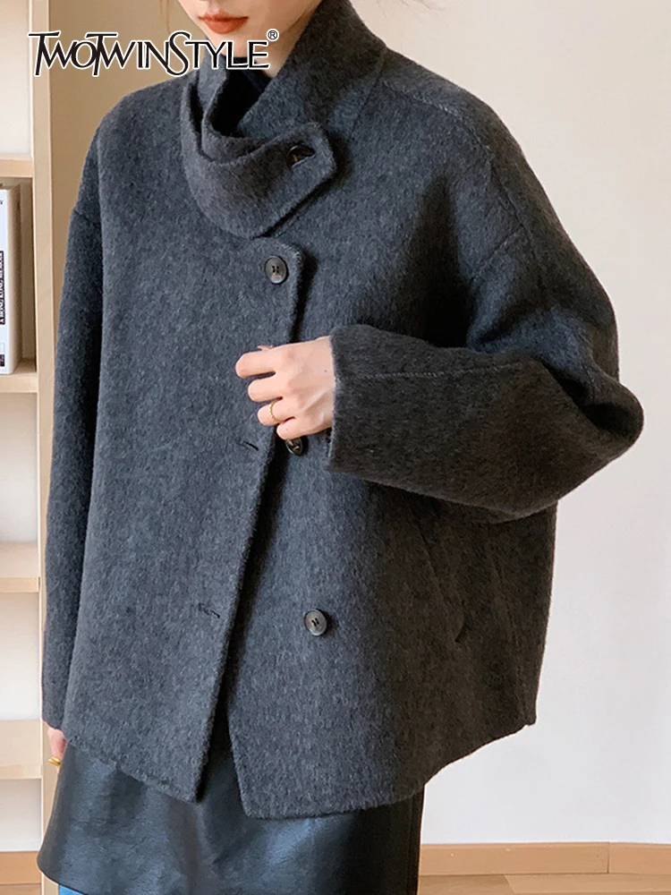 TWOTWINSTYLE Solid Patchwork Pockets Casual Loose Coats For Women Stand Collar Long Sleeve Spliced Single Breasted Coat Female
TWOTWINSTYLE Solid Patchwork Pockets Casual Loose Coats For Women Stand Collar Long Sleeve Spliced Single Breasted Coat Female