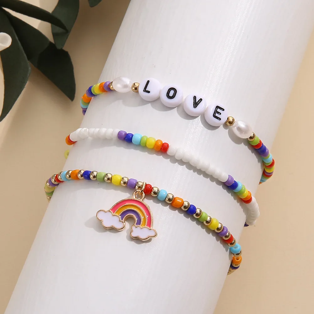 New Boho Fashion Rice Bead Letters LOVE Love Rainbow Pendant Three Piece Bracelet for Women Girl Wholesale
New Boho Fashion Rice Bead Letters LOVE Love Rainbow Pendant Three Piece Bracelet for Women Girl Wholesale