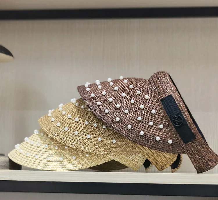 Spring and Summer New Sun Hat Woman European Pearl Decoration Fine Wheat Grass Empty Top Hat Beach Sunscreen Letter Straw Hat
Spring and Summer New Sun Hat Woman European Pearl Decoration Fine Wheat Grass Empty Top Hat Beach Sunscreen Letter Straw Hat