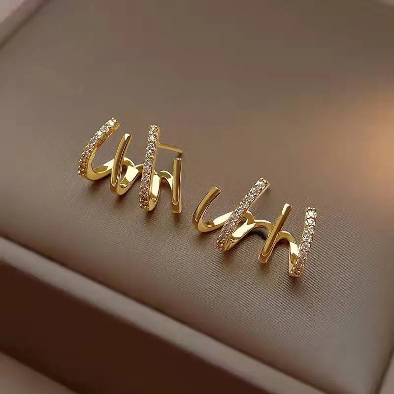 Korean Fashion Gold Temperament Simple and Compact Integrated Claw / Zircon Flower Curve Versatile Earrings for Women's Jewelry
Korean Fashion Gold Temperament Simple and Compact Integrated Claw / Zircon Flower Curve Versatile Earrings for Women's Jewelry