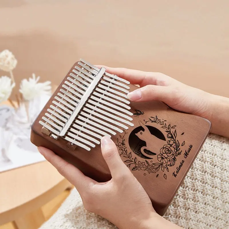 17 Keys Cats Kalimba for Beginners Hollow Out Finger Piano Gradual Color Children Gifts Portable Mini Musical Instruments 2022
17 Keys Cats Kalimba for Beginners Hollow Out Finger Piano Gradual Color Children Gifts Portable Mini Musical Instruments 2022