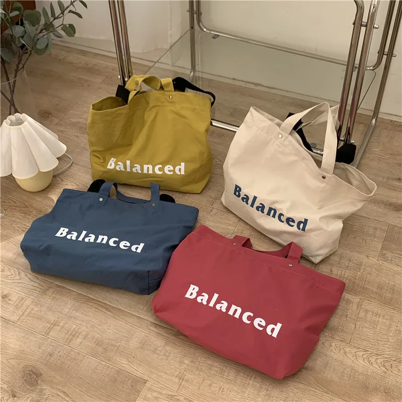 New Fashion One Shoulder Messenger Letter Printing Portable Canvas Large Capacity Tote Simple and Versatile Bag
New Fashion One Shoulder Messenger Letter Printing Portable Canvas Large Capacity Tote Simple and Versatile Bag