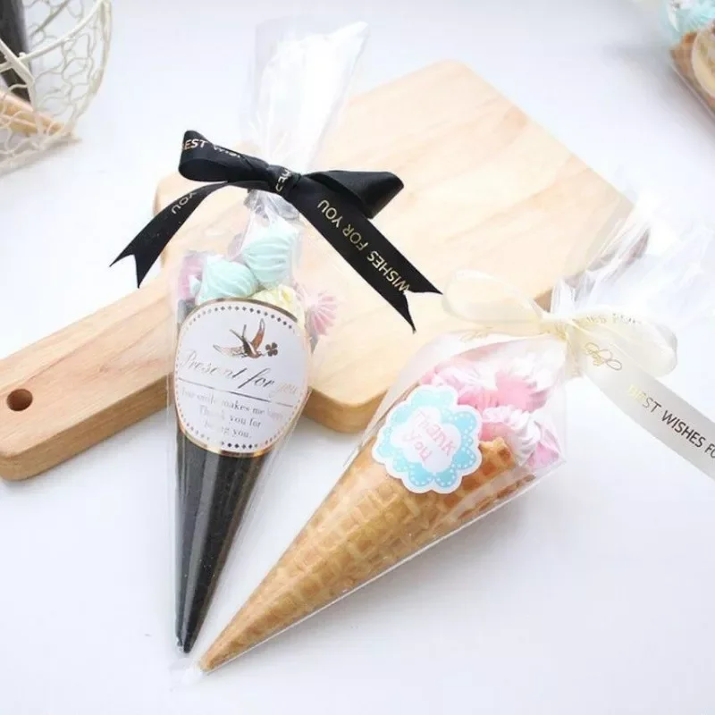 50pcs Wrapping Supplies Cone Candy Sweets Bag Birthday Party Gift Clear Cellophane Packing Bag Kitchen Plastic Food Bag
50pcs Wrapping Supplies Cone Candy Sweets Bag Birthday Party Gift Clear Cellophane Packing Bag Kitchen Plastic Food Bag