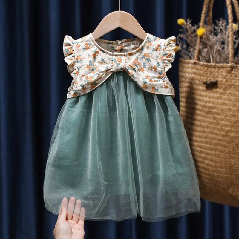 Ruffles Patchwork Sleeveless Fragmented Floral Print Kids Clothes Girls Round Neck Single Row Two Buttons Casual Net Yarn Dress
Ruffles Patchwork Sleeveless Fragmented Floral Print Kids Clothes Girls Round Neck Single Row Two Buttons Casual Net Yarn Dress